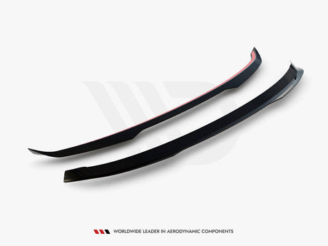 Two black aerodynamic components, slightly curved with red accents, are positioned parallel against a light background. Below, text reads, "WORLDWIDE LEADER IN AERODYNAMIC COMPONENTS."