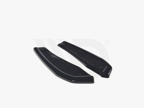 Two sleek black aerodynamic components rest on a plain white background. Text reads: "WORLDWIDE LEADER IN AERODYNAMIC COMPONENTS."