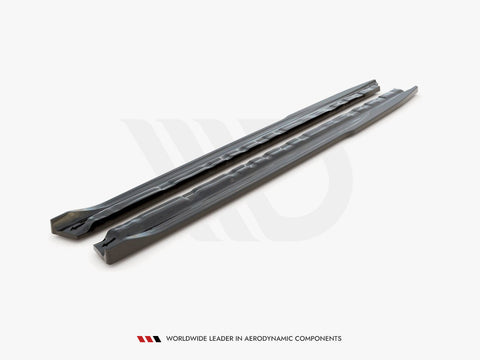 Two long, sleek car components are placed parallel on a plain surface. The text reads, "WORLDWIDE LEADER IN AERODYNAMIC COMPONENTS."