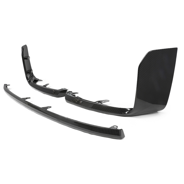 Two black carbon fiber car parts, likely aerodynamic components, are positioned on a white background. The parts feature a sleek, glossy finish with mounting features underneath.