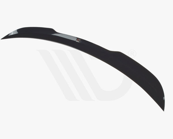 A sleek, black car spoiler curves elegantly against a white background, highlighting its aerodynamic design. Below, text reads "WORLDWIDE LEADER IN AERODYNAMIC COMPONENTS."