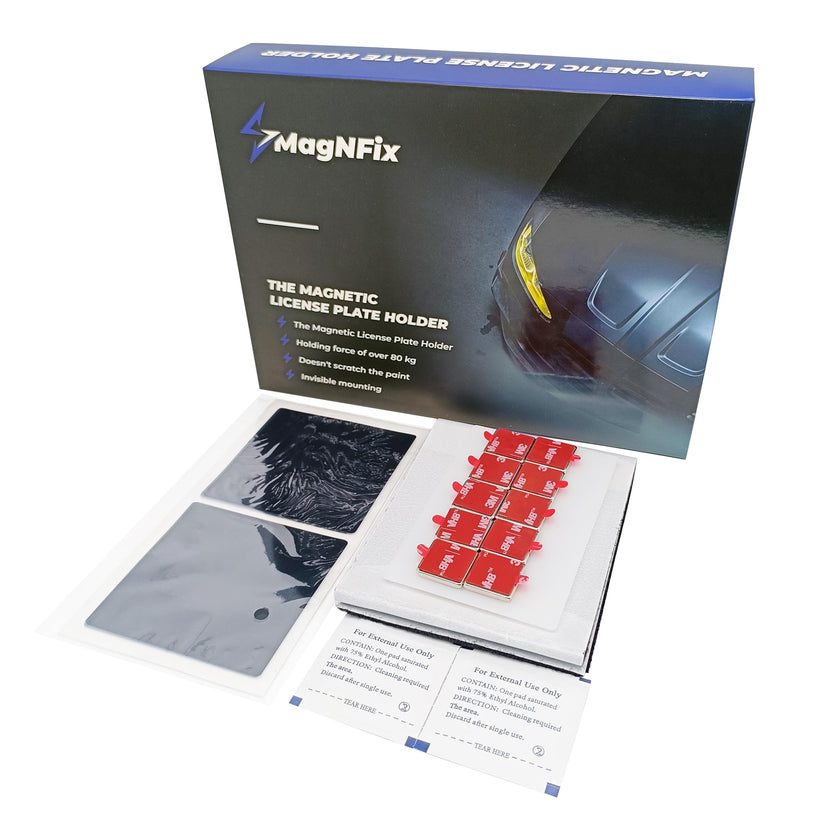 Box containing MagNFix magnetic license plate holder components. Includes magnets, adhesive mounts, and instructions. Text: "The Magnetic License Plate Holder," "Holding force of over 80 kg," "Doesn't scratch the paint," "Invisible mounting."