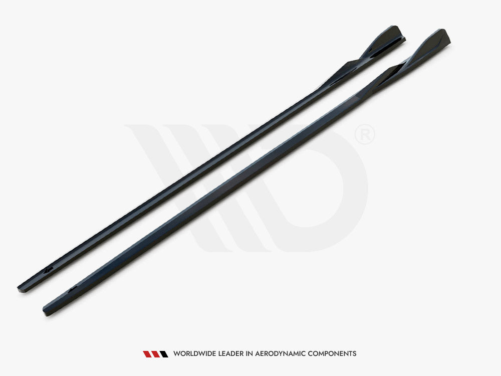 Two elongated, sleek black components lie parallel on a white surface. They have a contoured design for aerodynamics. Text below reads, "WORLDWIDE LEADER IN AERODYNAMIC COMPONENTS."