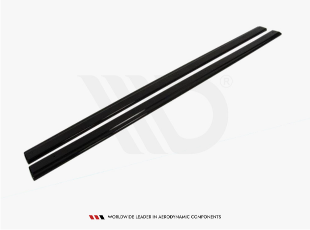 Two long, sleek black bars lie parallel, likely aerodynamic components, set against a plain, white background. Text below reads: "WORLDWIDE LEADER IN AERODYNAMIC COMPONENTS."