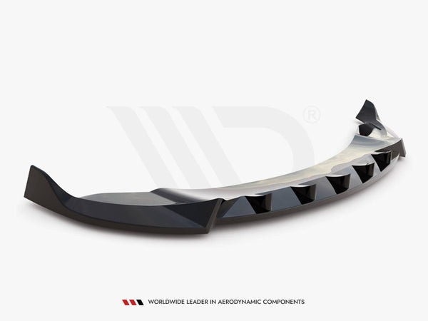 A black, aerodynamically designed car spoiler with angular edges rests against a plain white background. Text at the bottom reads, "WORLDWIDE LEADER IN AERODYNAMIC COMPONENTS."