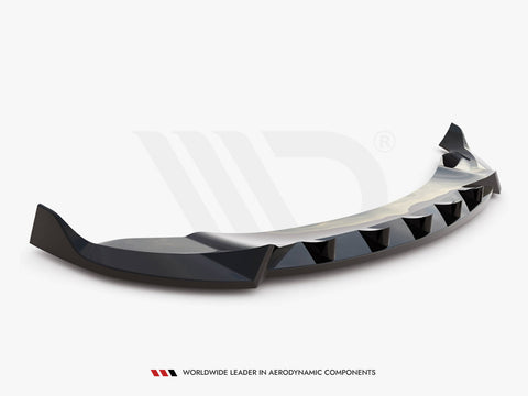 A black, aerodynamically designed car spoiler with angular edges rests against a plain white background. Text at the bottom reads, "WORLDWIDE LEADER IN AERODYNAMIC COMPONENTS."