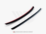 A pair of sleek, black aerodynamic components, one with a red stripe, are displayed against a white background. Text underneath reads: 