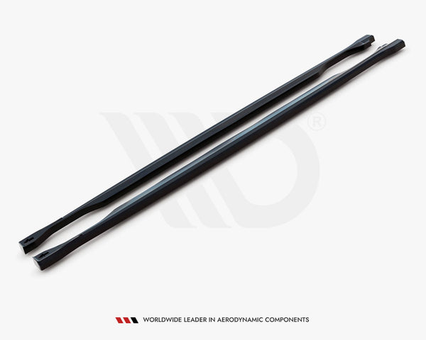 Two long, black, aerodynamic bars lie parallel on a white surface. A logo is subtly visible behind them. Text below reads: "WORLDWIDE LEADER IN AERODYNAMIC COMPONENTS."
