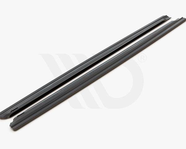 Two long, black side skirts lie parallel on a white background. Below, text reads: "WORLDWIDE LEADER IN AERODYNAMIC COMPONENTS."