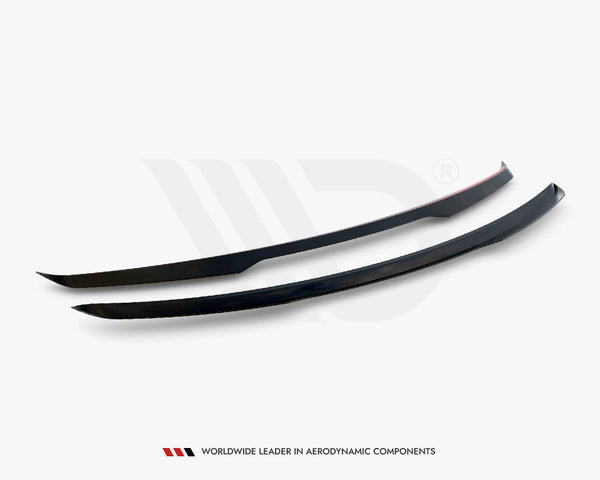 Two sleek, black aerodynamic components are positioned side by side on a flat surface. One has a red stripe. Text below reads: "WORLDWIDE LEADER IN AERODYNAMIC COMPONENTS."