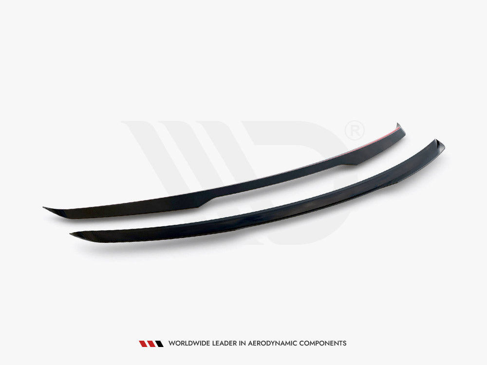 Two sleek, black aerodynamic components are positioned side by side on a flat surface. One has a red stripe. Text below reads: "WORLDWIDE LEADER IN AERODYNAMIC COMPONENTS."