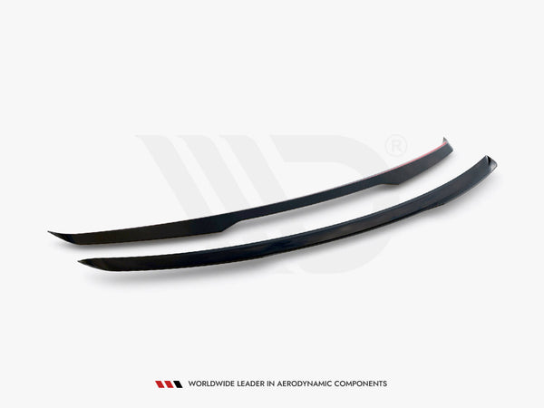 Two sleek, black aerodynamic components are positioned side by side on a flat surface. One has a red stripe. Text below reads: "WORLDWIDE LEADER IN AERODYNAMIC COMPONENTS."