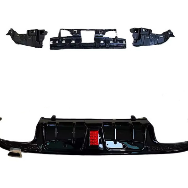 Black car bumper components are arranged on a white background. The largest piece features a red reflector at the center, while smaller components include grille sections and side parts.