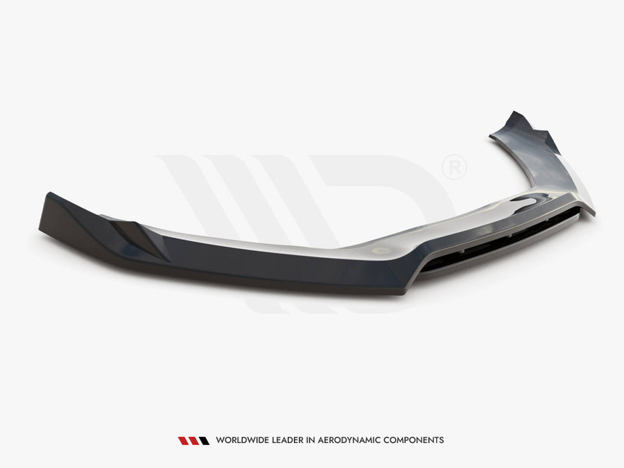 A dark, aerodynamic car spoiler lies on a white surface. Below it, text reads: "WORLDWIDE LEADER IN AERODYNAMIC COMPONENTS."