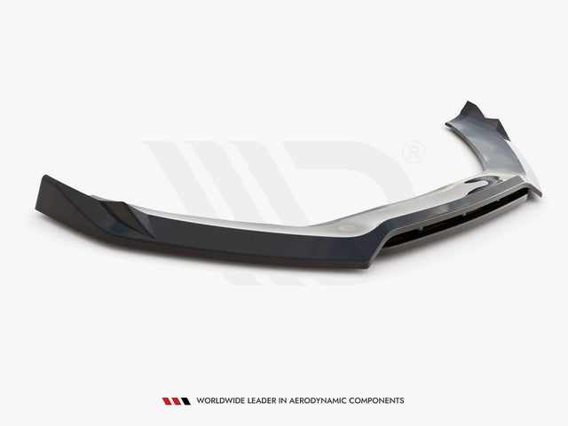 A dark, aerodynamic car spoiler lies on a white surface. Below it, text reads: "WORLDWIDE LEADER IN AERODYNAMIC COMPONENTS."