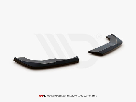 Two black aerodynamic components, angled and glossy, rest on a plain white surface. Text: "WORLDWIDE LEADER IN AERODYNAMIC COMPONENTS" appears below.