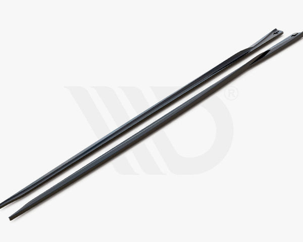 Two sleek, elongated black strips with tapered ends rest side-by-side on a plain gray surface. Text reads, "WORLDWIDE LEADER IN AERODYNAMIC COMPONENTS."