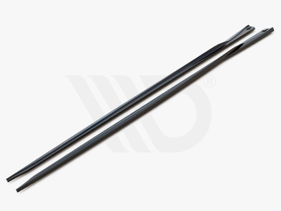Two sleek, elongated black strips with tapered ends rest side-by-side on a plain gray surface. Text reads, "WORLDWIDE LEADER IN AERODYNAMIC COMPONENTS."