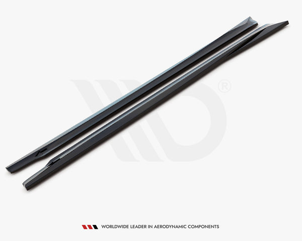 Two sleek black aerodynamic components lie flat on a plain white background. Text below reads: "WORLDWIDE LEADER IN AERODYNAMIC COMPONENTS."