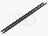 Two long, black aerodynamic components resting parallel against a white background. Text below reads, 