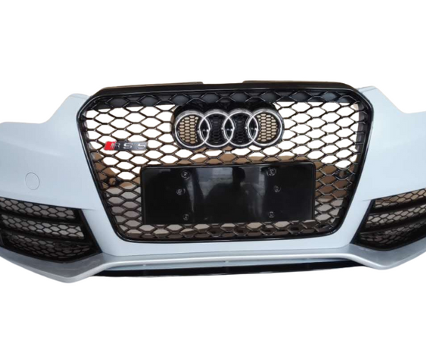 A car's front bumper features a black honeycomb grille with four interlocking rings and "RS5" emblem, set against a plain white background.