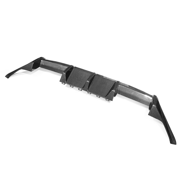 A carbon fiber car diffuser, featuring aerodynamic fins, is displayed on a plain white background. The structure is sleek and angular, designed to enhance vehicle performance.