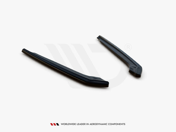Two elongated, dark aerodynamic components lie parallel on a white surface. Text below reads, "WORLDWIDE LEADER IN AERODYNAMIC COMPONENTS."