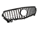 A black and chrome car grille with vertical slats and a central circular opening, positioned against a plain white background.