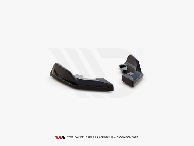 Two black aerodynamic components are displayed on a plain white background. There is text below: "WORLDWIDE LEADER IN AERODYNAMIC COMPONENTS."