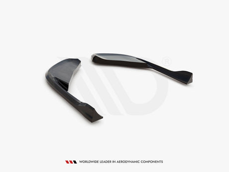 Two sleek, curved black aerodynamic components are positioned on a white surface. Below, text reads: "WORLDWIDE LEADER IN AERODYNAMIC COMPONENTS."