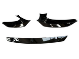 Black car spoiler kit; composed of three glossy, aerodynamic parts positioned on a white background, indicating components ready for vehicle attachment to enhance performance and aesthetics.