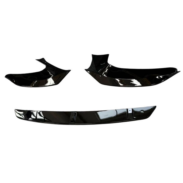 Black car spoiler kit; composed of three glossy, aerodynamic parts positioned on a white background, indicating components ready for vehicle attachment to enhance performance and aesthetics.