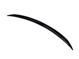 A sleek, curved, black car spoiler positioned diagonally against a white background, showcasing its aerodynamic design.