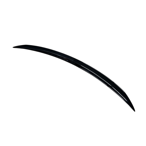 A sleek, curved, black car spoiler positioned diagonally against a white background, showcasing its aerodynamic design.