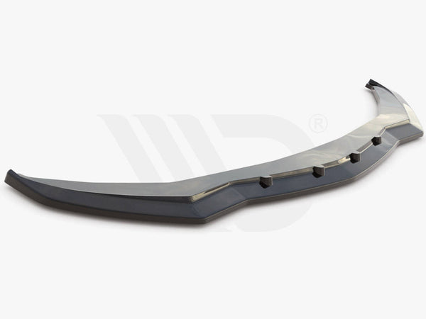 A black car front splitter with angular design and six protruding tabs sits on a plain white background. Text reads: "WORLDWIDE LEADER IN AERODYNAMIC COMPONENTS."