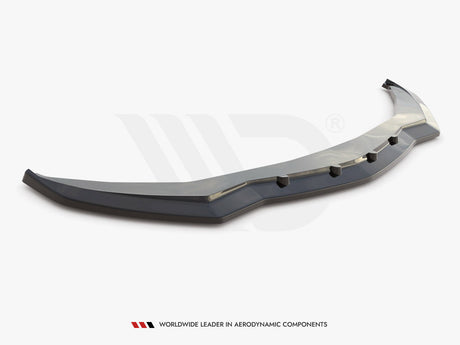 A black car front splitter with angular design and six protruding tabs sits on a plain white background. Text reads: "WORLDWIDE LEADER IN AERODYNAMIC COMPONENTS."