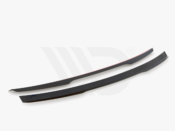 Two sleek black aerodynamic components are displayed on a white background. They are thin, elongated, and slightly curved. Text below reads, "WORLDWIDE LEADER IN AERODYNAMIC COMPONENTS."