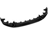 A glossy, carbon fiber car bumper lip is shown from the front, detached and isolated on a white background, highlighting its aerodynamic design and mounting features.