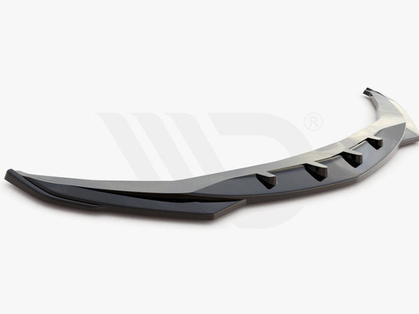 A sleek, black aerodynamic car component with fin-like protrusions rests on a plain white background. Text below reads: "Worldwide leader in aerodynamic components."