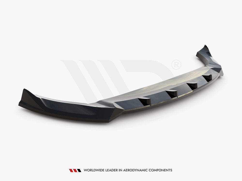 A black car bumper lip spoiler, angled with aerodynamic features, rests on a plain white background. Text reads “WORLDWIDE LEADER IN AERODYNAMIC COMPONENTS.”