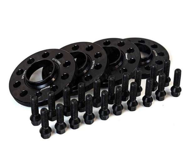 Black wheel spacers are arranged neatly, accompanied by multiple bolts aligned in front. The context is a plain white background. Some spacers display text: "S7-10-5885," "S90-160 4A."