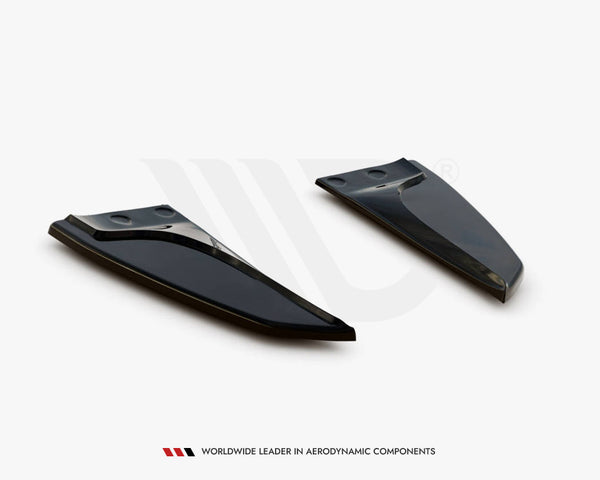 Two sleek, black aerodynamic components are positioned on a plain white background. Text at the bottom reads: "WORLDWIDE LEADER IN AERODYNAMIC COMPONENTS."