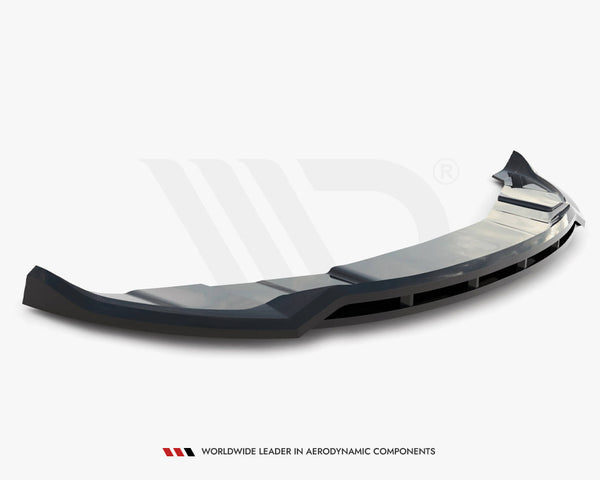 A sleek, black car spoiler rests on a white surface, featuring angular lines and vents, with the text "WORLDWIDE LEADER IN AERODYNAMIC COMPONENTS" below it.