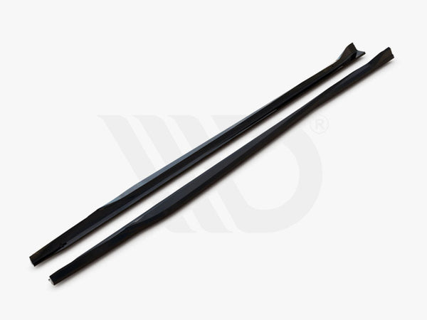 Two long, black aerodynamic components lie parallel on a white surface, with text, "WORLDWIDE LEADER IN AERODYNAMIC COMPONENTS," displayed underneath.