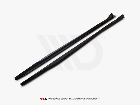 Two long, black aerodynamic components lie parallel on a white surface, with text, "WORLDWIDE LEADER IN AERODYNAMIC COMPONENTS," displayed underneath.