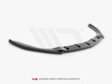 A glossy black car spoiler, featuring angular fins, rests on a plain white background. Text at the bottom reads, 