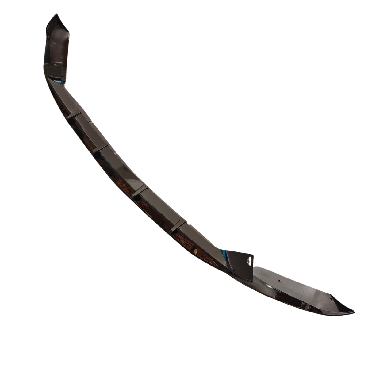 A sleek, black car bumper lip with angled segments resting on a white background, featuring a hole for attachment, likely enhancing vehicle aerodynamics.