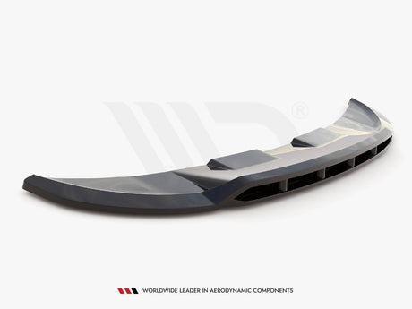 Curved car spoiler resting on a flat surface, featuring aerodynamic vents and a glossy finish. Below, text reads: "WORLDWIDE LEADER IN AERODYNAMIC COMPONENTS." The background is plain white.