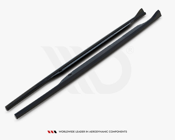 Two black, elongated aerodynamic components lie parallel on a white surface, featuring smooth edges. Below, text reads: "WORLDWIDE LEADER IN AERODYNAMIC COMPONENTS."