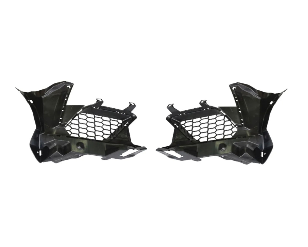 Two black plastic car components with honeycomb cutouts are symmetrically positioned. They have angular designs, suggesting automotive parts, likely for ventilation or structural support. Plain white background.